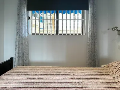 Cama o camas de una habitación en Apartamento cerca de la playa