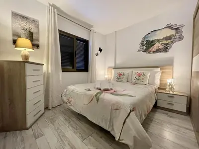 Cama o camas de una habitación en Dowtown Holiday Home in Playa del Ingles