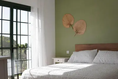 Cama o camas de una habitación en Casa Notas de Color Y Sal