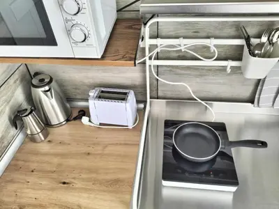 Una cocina o zona de cocina en MINI estudio El Reloj