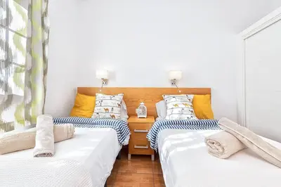 Cama o camas de una habitación en BUNGALOWS LOS ARCOS 77