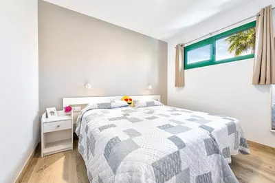 Cama o camas de una habitación en Apartamento céntrico en playa del inglés