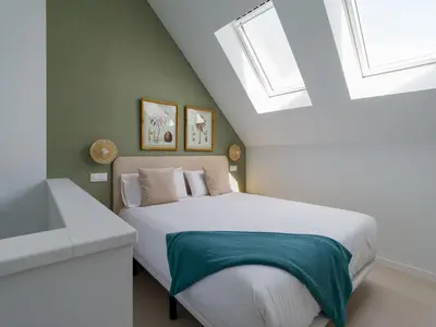 Cama o camas de una habitación en Royal Suites-Viviendas Vacacionales