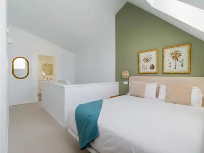 Cama o camas de una habitación en Royal Suites-Viviendas Vacacionales