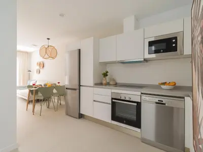 Una cocina o zona de cocina en Royal Suites-Viviendas Vacacionales