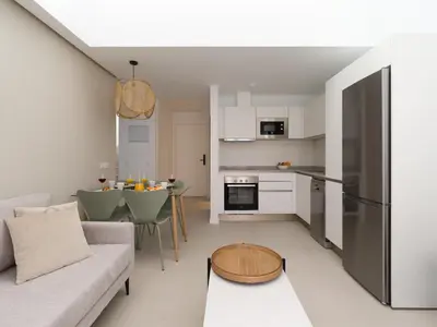 Una cocina o zona de cocina en Royal Suites-Viviendas Vacacionales